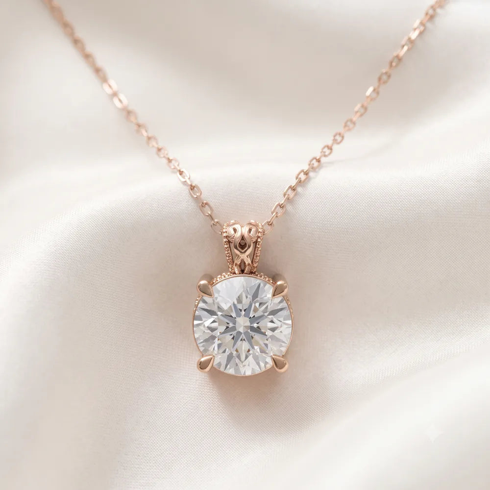 Solitaire pendant design in rose gold presented on ivory silk