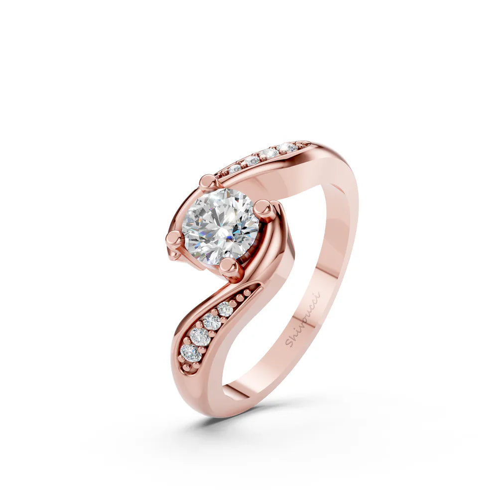 Bypass solitaire ring design in rose gold, angled view