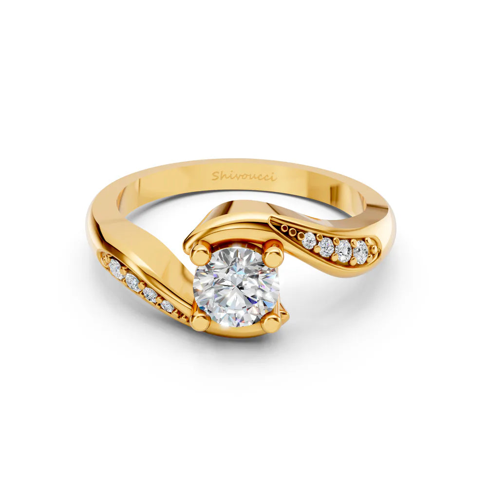 Bypass solitaire ring design in yellow gold with stone-set shoulders