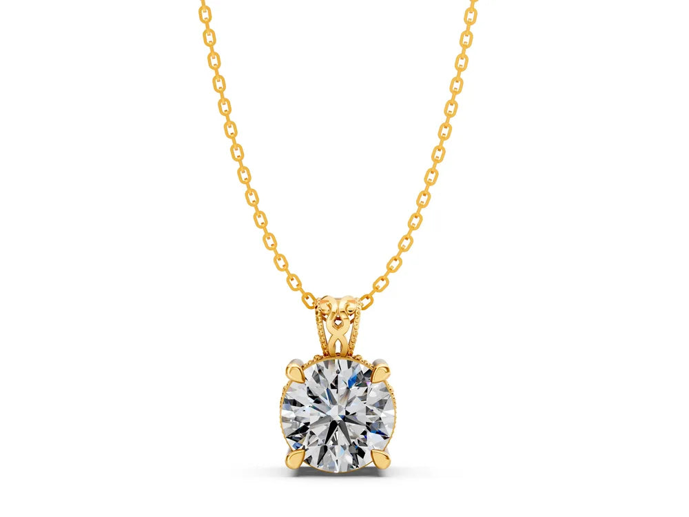 Yellow gold solitaire pendant with a round diamond on a white background